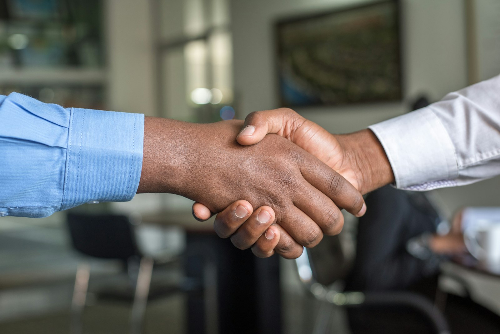 Two professionals sealing an agreement with a handshake